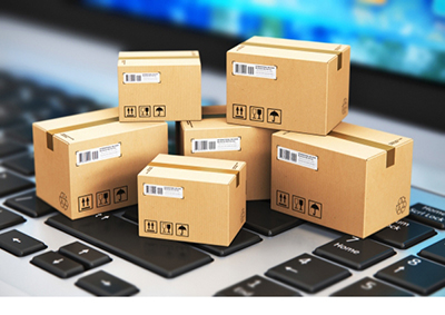 Boxes on a keyboard to symbolize the tech side of logistics and transport.