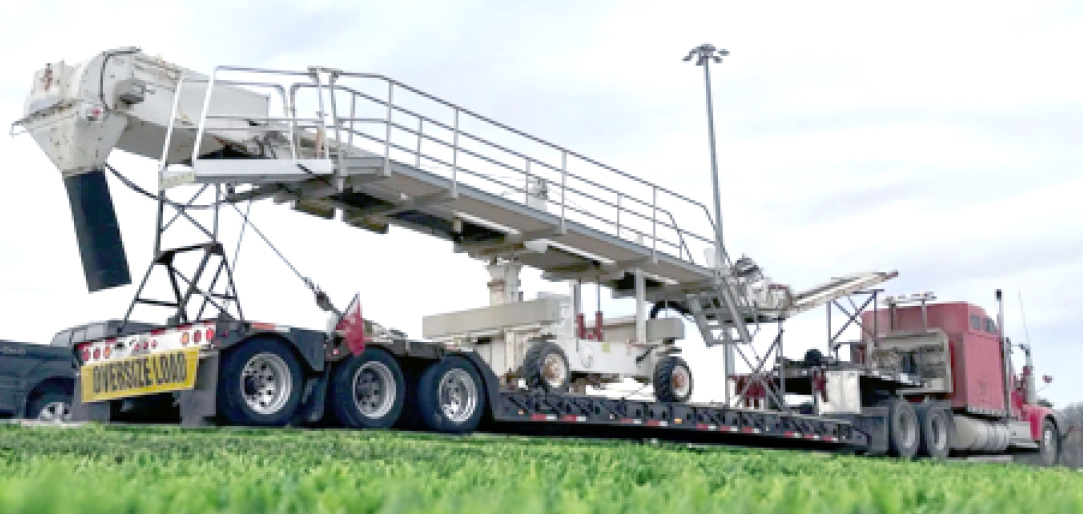 Buchanan Hauling and Rigging transports a conveyor or elevator system using their stepdeck trailer.